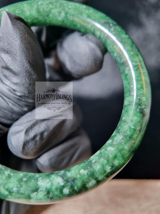 Premium natural moss green jade bangle with white shimmer, an ideal feng shui gift for luck, prosperity, Christmas and New Year celebrations