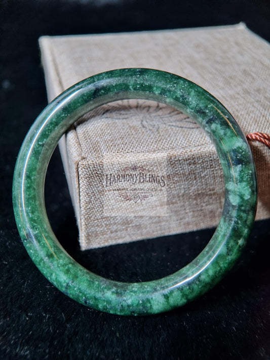 Premium natural moss green jade bangle with white shimmer, an ideal feng shui gift for luck, prosperity, Christmas and New Year celebrations